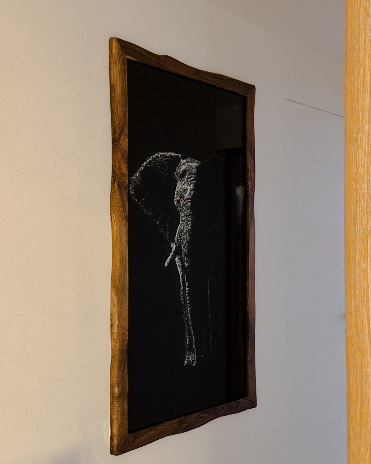 Commissioned elephant in glass, framed in walnut